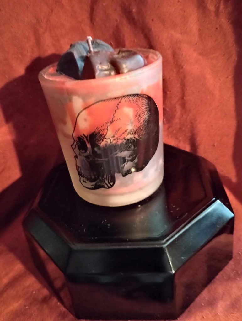 a red skull candle